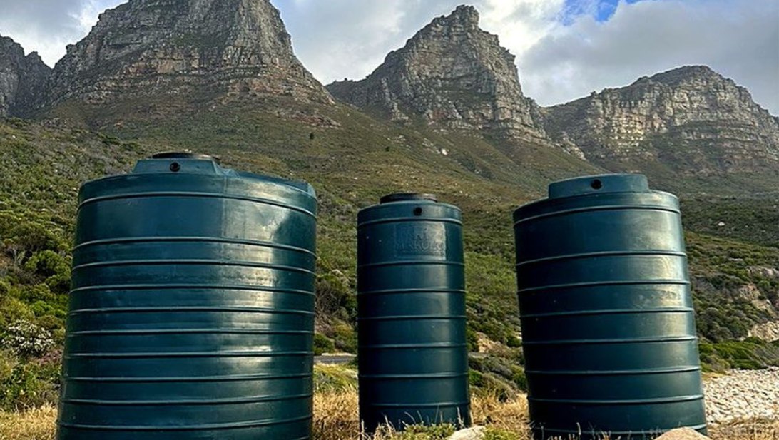 Three green water tanks moulded from Fenix powder, below the Twelve Apostles, Cape Town